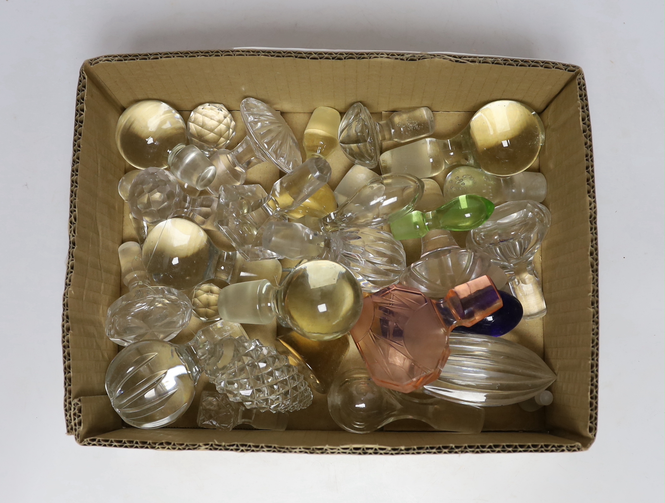 A collection of decanter and scent bottle stoppers